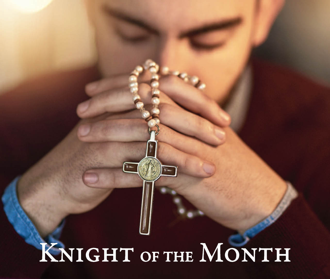 Photo of man praying with folded hands holding rosary